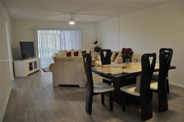 700 SW 128th Ave Unit 106C, Pembroke Pines, FL 33027 - dining area with wood finished floors, a ceiling fan, and baseboards