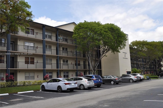 700 SW 128th Ave Unit 106C, Pembroke Pines, FL 33027 - view of apartment building / complex featuring uncovered parking
