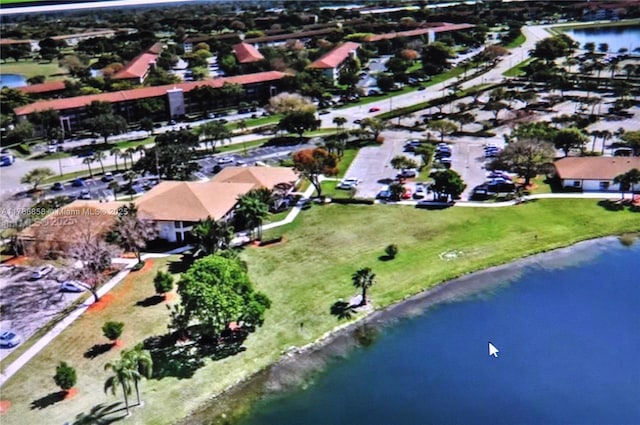 700 SW 128th Ave Unit 106C, Pembroke Pines, FL 33027 - aerial view of property and surrounding area featuring a large body of water and nearby suburban area