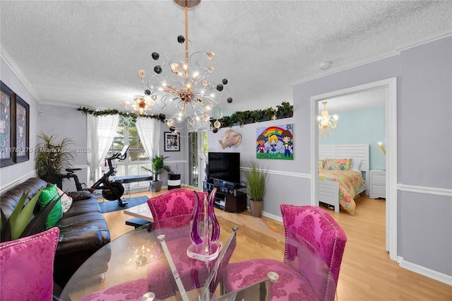 1280 S Alhambra Cir Unit 1207, Coral Gables, FL 33146 - living room featuring a chandelier, a textured ceiling, ornamental molding, and wood finished floors