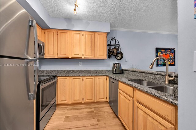 1280 S Alhambra Cir Unit 1207, Coral Gables, FL 33146 - kitchen with appliances with stainless steel finishes, light wood-style flooring, ornamental molding, a textured ceiling, and dark stone counters