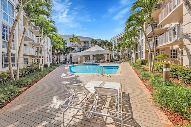 1280 S Alhambra Cir Unit 1207, Coral Gables, FL 33146 - community pool with a patio area