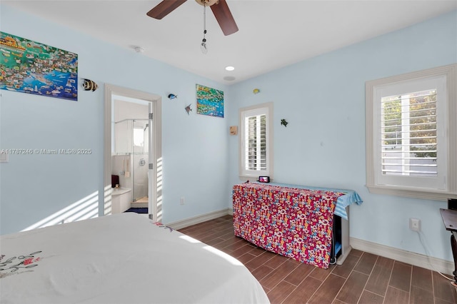 bedroom with wood tiled floor, a ceiling fan, and baseboards