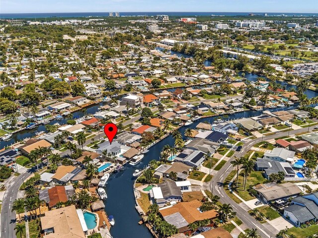 drone / aerial view with a residential view and a water view
