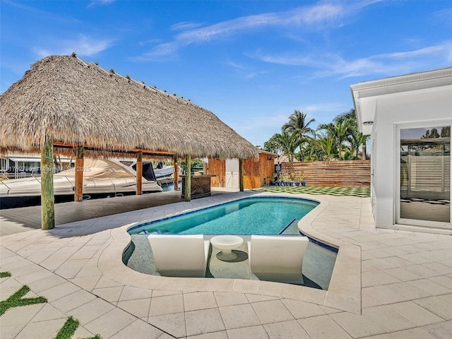 view of pool with a fenced in pool, a patio, and fence