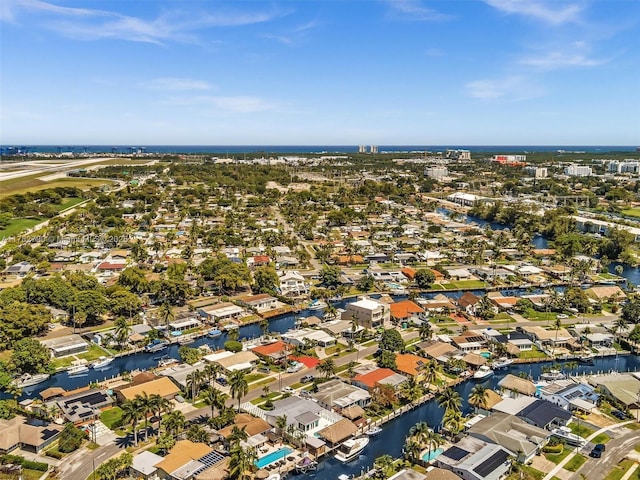 drone / aerial view featuring a water view and a residential view