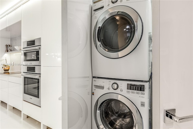 10205 Collins Ave Unit 1106, Bal Harbour, FL 33154 - washroom featuring stacked washing machine and dryer