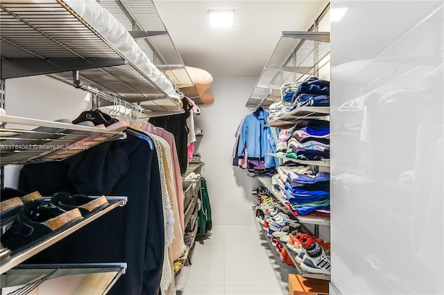 10205 Collins Ave Unit 1106, Bal Harbour, FL 33154 - spacious closet with tile patterned flooring