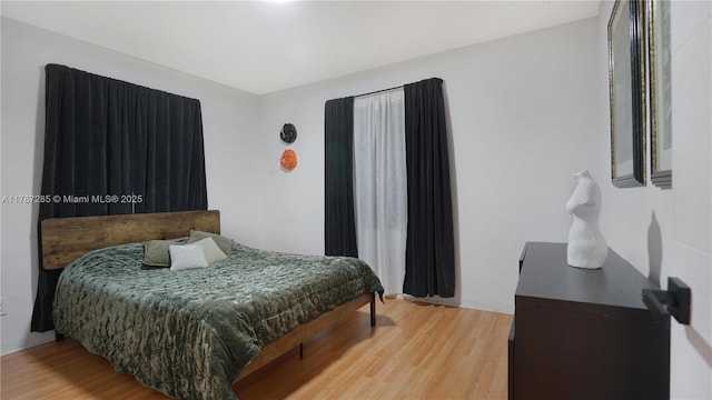 bedroom with light wood-style floors