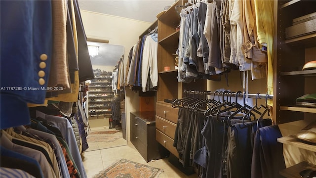 spacious closet with tile patterned floors