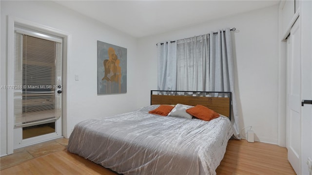 bedroom with light wood-style floors