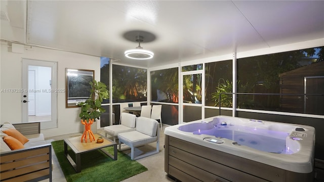 sunroom / solarium with a hot tub