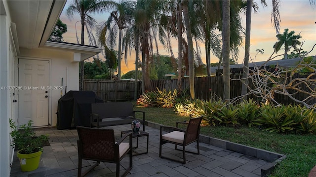 view of patio / terrace featuring a fenced backyard and a grill