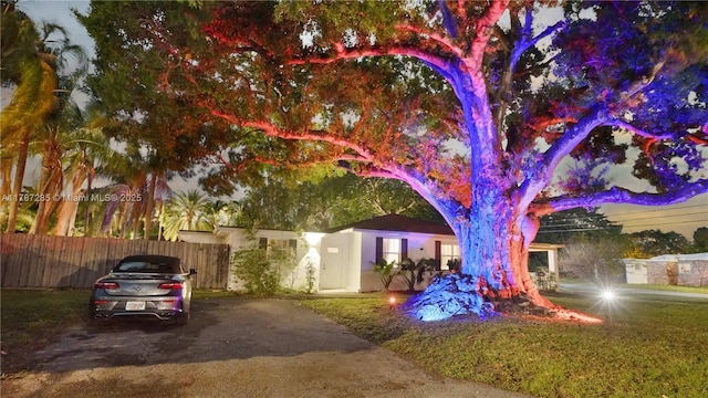 view of front of home featuring fence