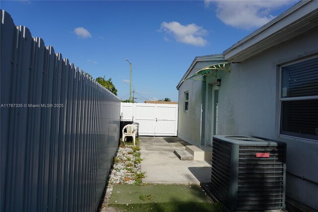 800 N 69th Ave, Hollywood, FL 33024 - fenced backyard featuring central AC and a patio