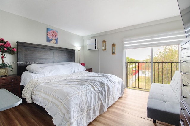 301 NW 109th Ave Unit 201, Miami, FL 33172 - bedroom with a wall unit AC, light wood finished floors, and access to exterior