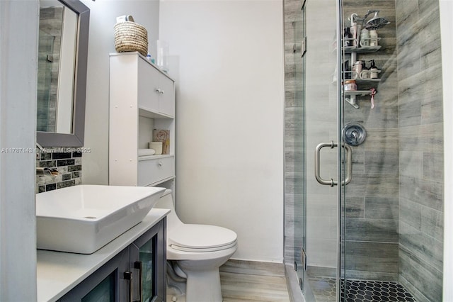 301 NW 109th Ave Unit 201, Miami, FL 33172 - bathroom with toilet, wood finished floors, vanity, and a stall shower