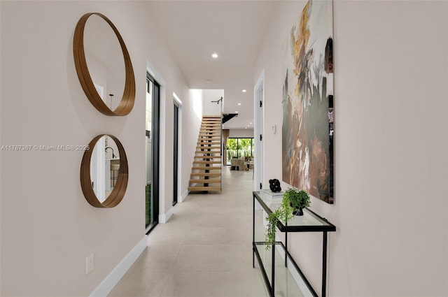 915 NE 17th Ter, Fort Lauderdale, FL 33304 - hallway with recessed lighting, stairway, and baseboards