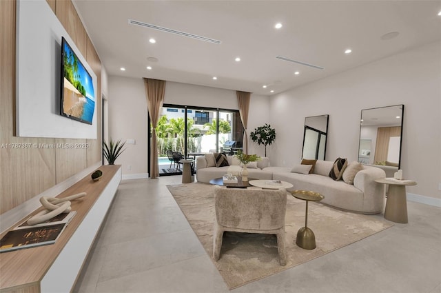 915 NE 17th Ter, Fort Lauderdale, FL 33304 - living room featuring baseboards, recessed lighting, and finished concrete flooring