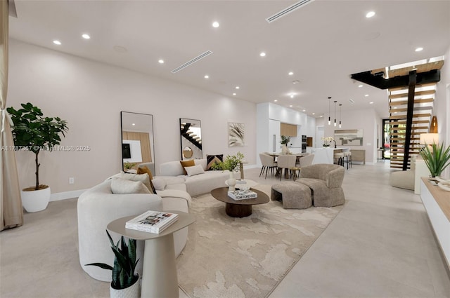 915 NE 17th Ter, Fort Lauderdale, FL 33304 - living area featuring recessed lighting, baseboards, and stairs