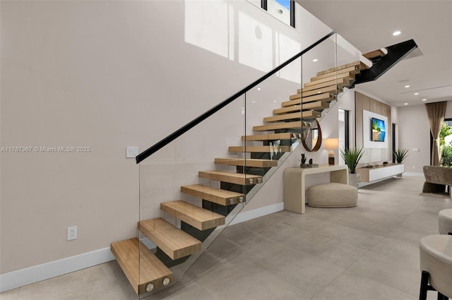 915 NE 17th Ter, Fort Lauderdale, FL 33304 - stairs with a high ceiling, baseboards, and recessed lighting
