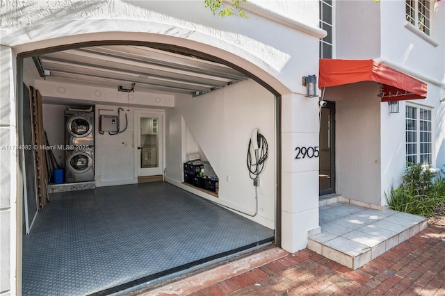 2905 Day Ave Unit 2A, Miami, FL 33133 - property entrance featuring stacked washer / dryer and stucco siding