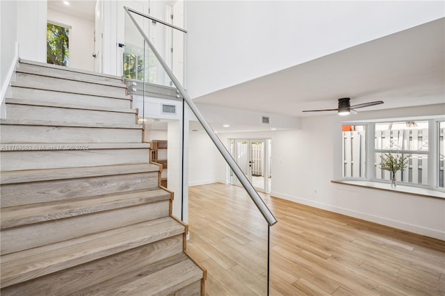 2905 Day Ave Unit 2A, Miami, FL 33133 - staircase with wood finished floors, a ceiling fan, baseboards, and french doors