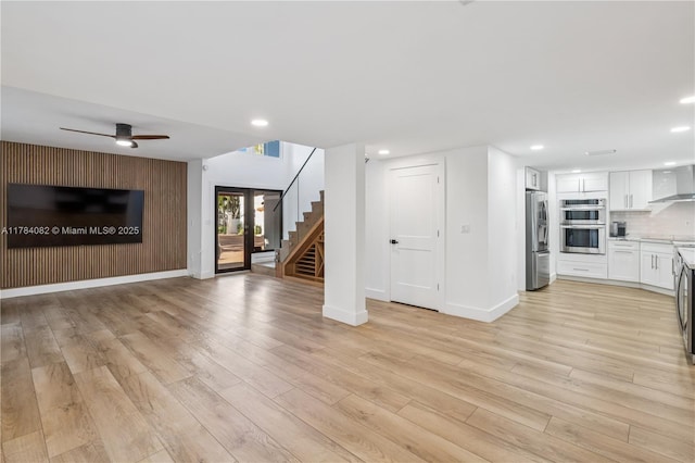 2905 Day Ave Unit 2A, Miami, FL 33133 - unfurnished living room featuring recessed lighting, baseboards, light wood finished floors, ceiling fan, and stairs