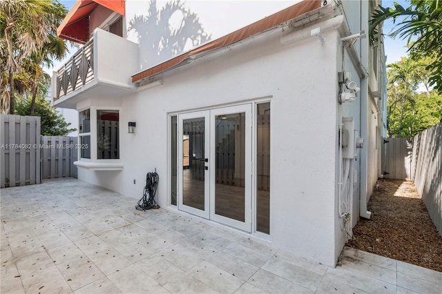 2905 Day Ave Unit 2A, Miami, FL 33133 - rear view of house featuring stucco siding, a patio area, a fenced backyard, french doors, and a balcony