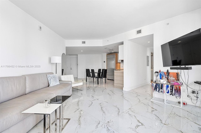 living room featuring light marble finish floors