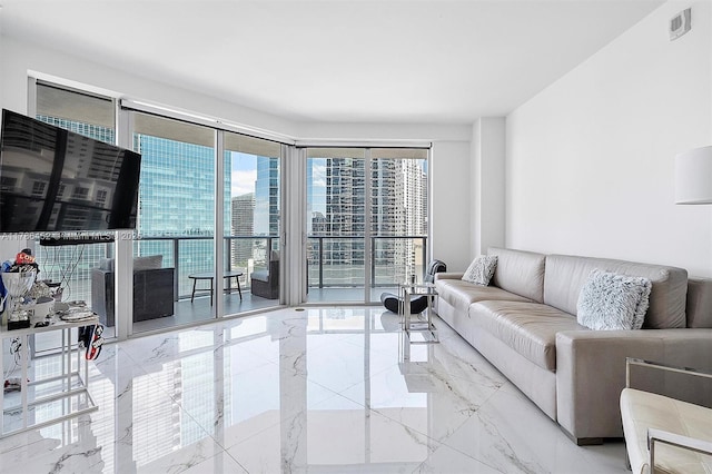 living room featuring marble tiled floors