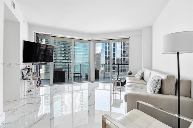 living area featuring marble tiled floors