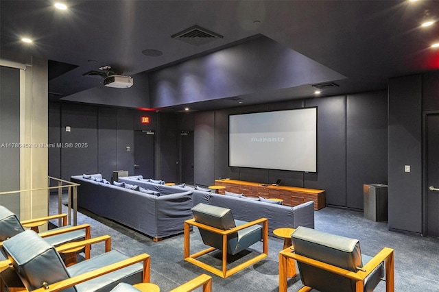 home theater featuring carpet, a decorative wall, and recessed lighting