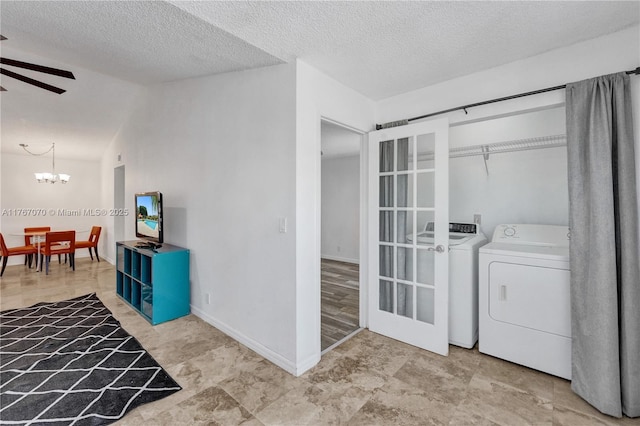 3460 N Pinewalk Dr N Unit 321, Margate, FL 33063 - washroom featuring a chandelier, ceiling fan, a textured ceiling, and separate washer and dryer