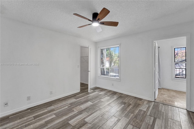 3460 N Pinewalk Dr N Unit 321, Margate, FL 33063 - spare room featuring wood finished floors, a ceiling fan, and a textured ceiling