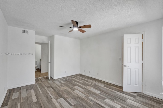 3460 N Pinewalk Dr N Unit 321, Margate, FL 33063 - unfurnished room featuring ceiling fan, wood finished floors, and a textured ceiling