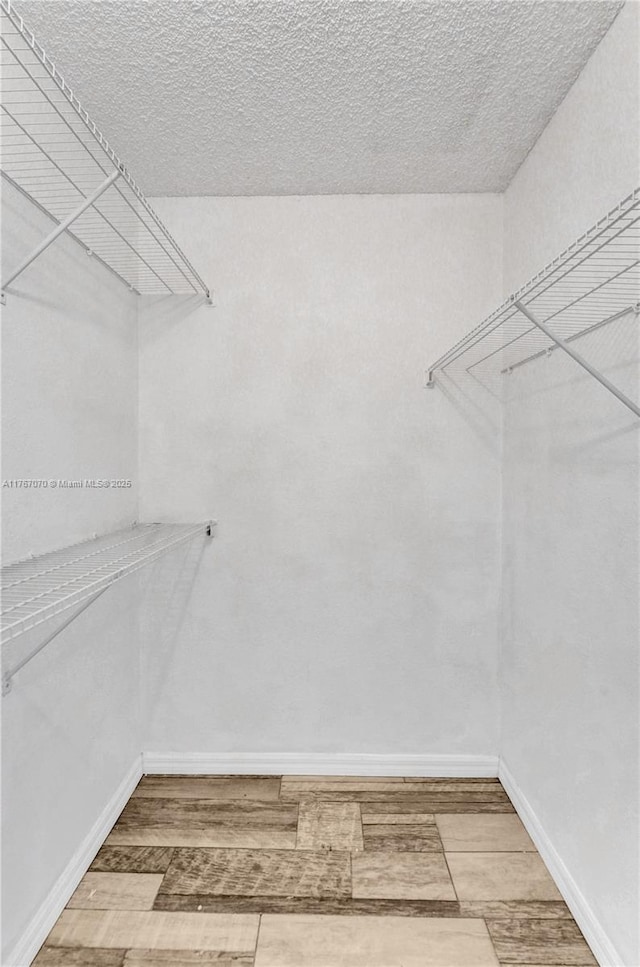3460 N Pinewalk Dr N Unit 321, Margate, FL 33063 - spacious closet featuring wood finished floors