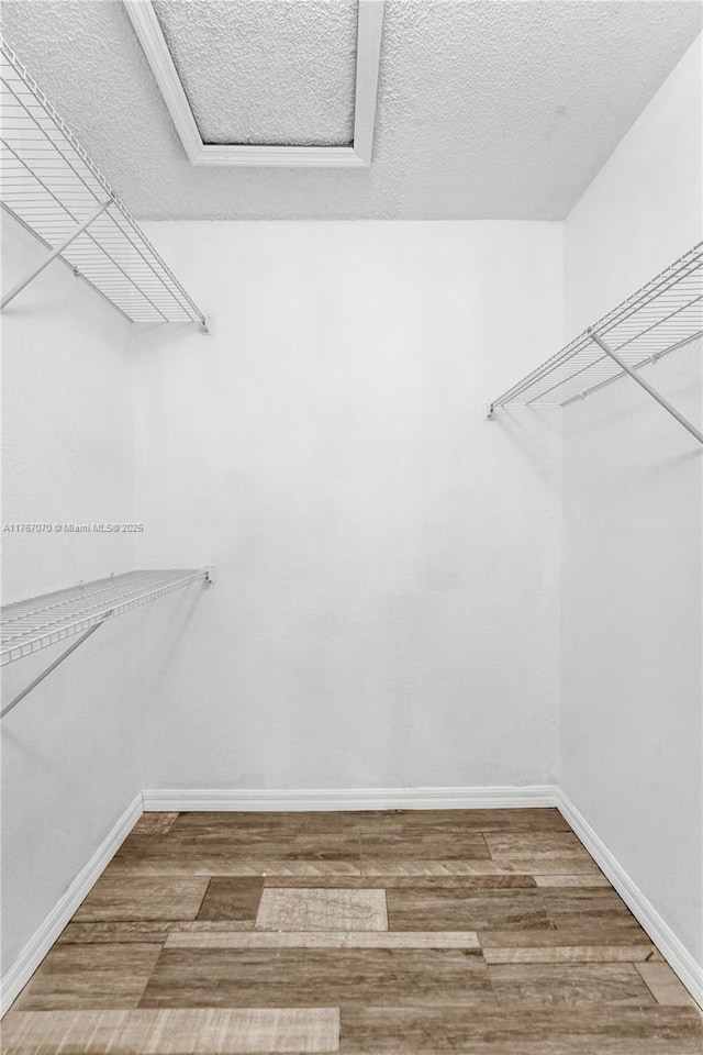 3460 N Pinewalk Dr N Unit 321, Margate, FL 33063 - walk in closet with wood finished floors