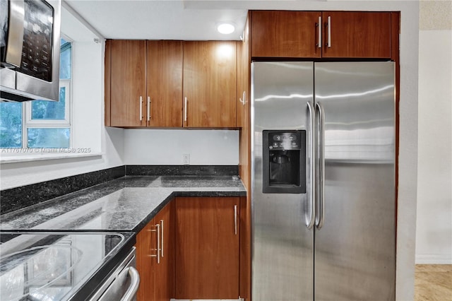 3460 N Pinewalk Dr N Unit 321, Margate, FL 33063 - kitchen with stainless steel appliances, brown cabinetry, and dark stone countertops