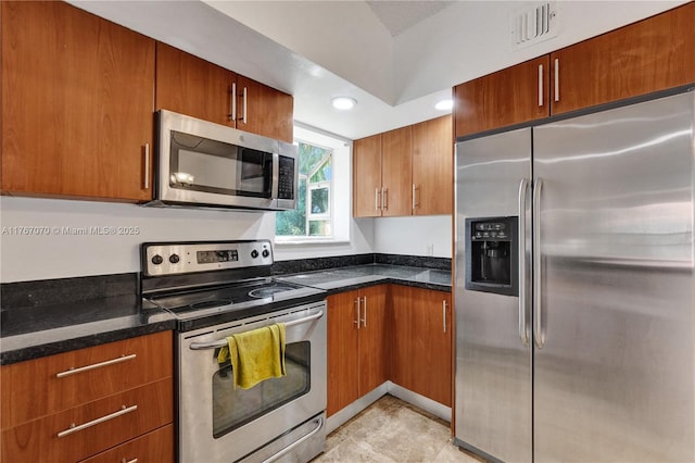 3460 N Pinewalk Dr N Unit 321, Margate, FL 33063 - kitchen with appliances with stainless steel finishes, brown cabinetry, dark stone counters, and recessed lighting