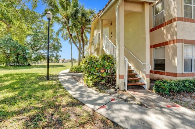3460 N Pinewalk Dr N Unit 321, Margate, FL 33063 - doorway to property with a lawn and stucco siding