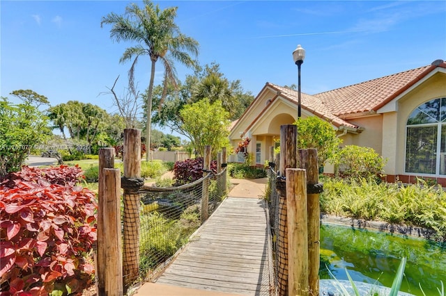 3460 N Pinewalk Dr N Unit 321, Margate, FL 33063 - rear view of house featuring stucco siding and a tiled roof
