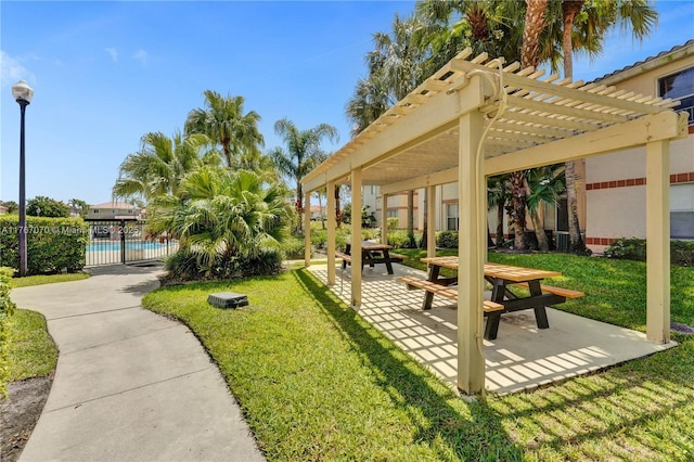 3460 N Pinewalk Dr N Unit 321, Margate, FL 33063 - view of property's community featuring a pergola, a swimming pool, and a patio