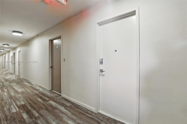 1831 NE 38th St Unit 402, Oakland Park, FL 33308 - hall featuring wood finished floors and baseboards
