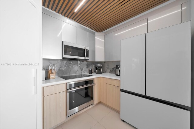 6694 NW 107th Pl, Doral, FL 33178 - kitchen featuring white appliances, light countertops, light brown cabinets, and backsplash
