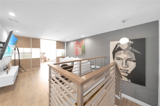 interior space featuring light wood finished floors, visible vents, and recessed lighting