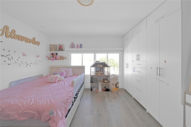 bedroom with light wood-style floors