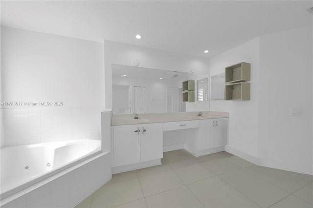 6694 NW 107th Pl, Doral, FL 33178 - bathroom featuring a tub with jets, double vanity, tile patterned flooring, baseboards, and recessed lighting