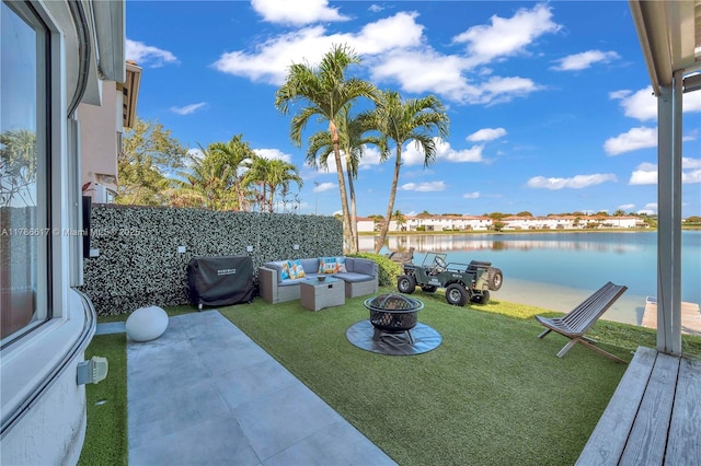 6694 NW 107th Pl, Doral, FL 33178 - view of grassy yard featuring an outdoor living space with a fire pit, a water view, and a patio area