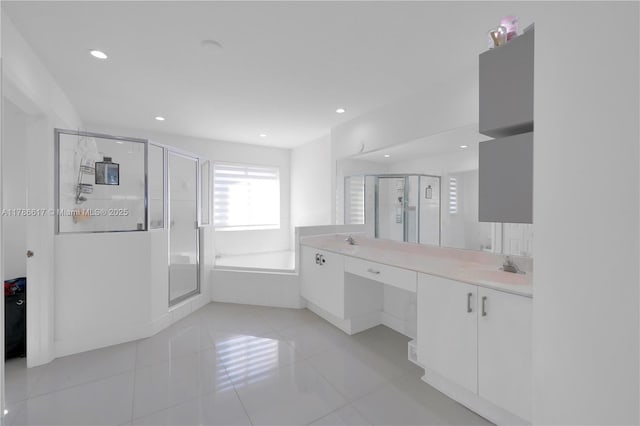 full bath with a stall shower, recessed lighting, tile patterned flooring, a garden tub, and vanity